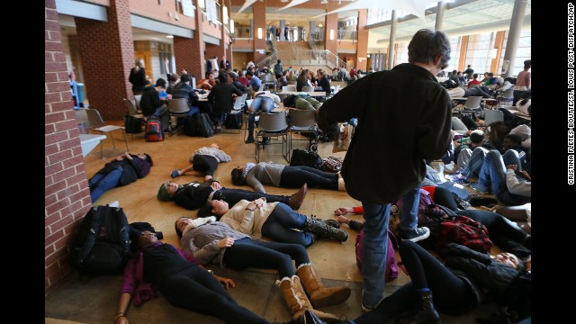 Students at Clayton High School in Clayton, Missouri, take part in a "die-in" protest in the school cafeteria on December 1.