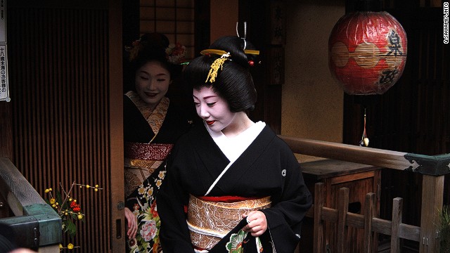 "Geisha are aware they are special ... and subject to interest, but people need to respect them," says Avi Lugasi, who runs a travel company in Kyoto. He helps clients get photos such as this one of an apprentice geisha leaving a tea house in Gion district. 