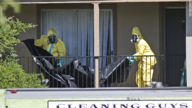 A hazardous materials team cleans the Dallas apartment where four contacts of Ebola patient Thomas Eric Duncan are under quarantine on Friday, October 3. Duncan, the first person diagnosed with Ebola on American soil, contracted the virus in his home country of Liberia.