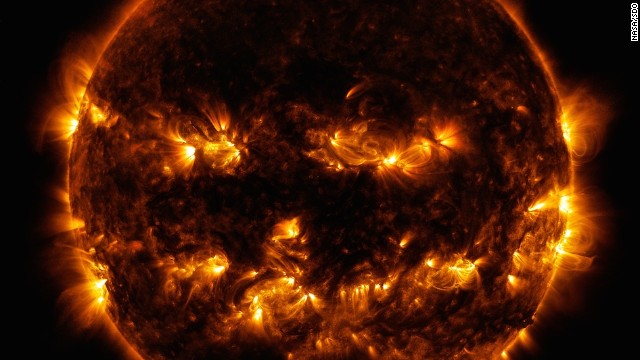 Active regions on the sun combined to resemble a jack-o-lantern's face on Oct. 8, 2014. The image was captured by NASA's Solar Dynamics Observatory, or SDO.
