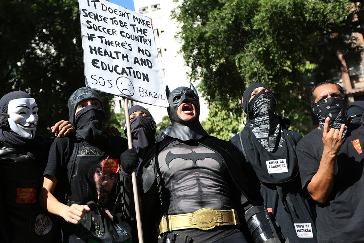 Batman joins forces with Guy Fawkes and members of Brazil's Black Bloc during an anti-Fifa protest in Rio during the opening match of the 2014 World Cup.