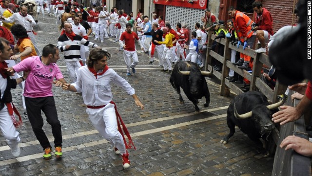 Participants run in front of bulls on July 9.