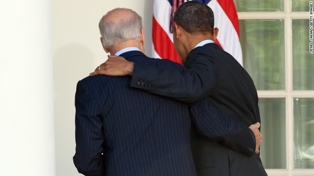 Obama and Biden walk at the White House together after Obama delivered a statement April 1 on the Affordable Care Act.