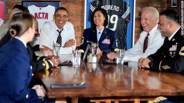 Obama and Biden have lunch with active duty service members at a Washington restaurant in November.