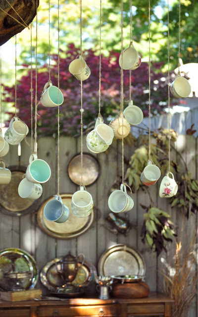 Hanging teacups for a whimsical garden wedding? (via Behind...