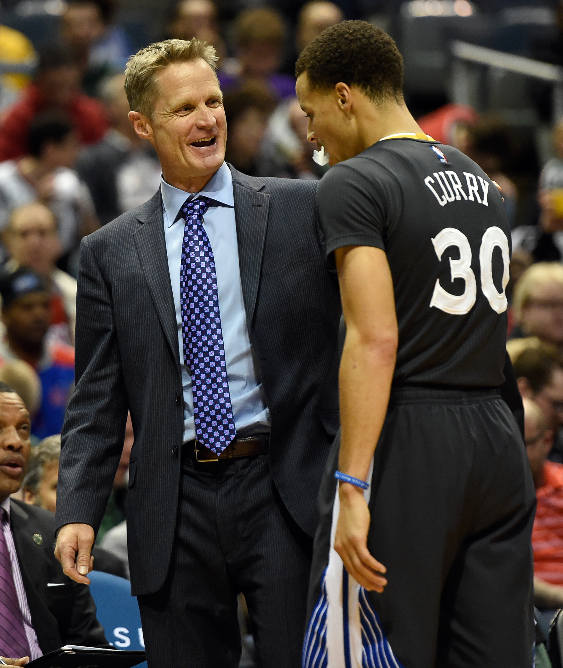 Mar 28, 2015; Milwaukee, WI, USA; Golden State Warriors head coach Steve Kerr reacts with guard Stephen Curry (30) in the fourth quarter during the game against the Milwaukee Bucks at BMO Harris Bradley Center. The Warriors beat the Bucks 108-95. (Benny Sieu-USA TODAY Sports)