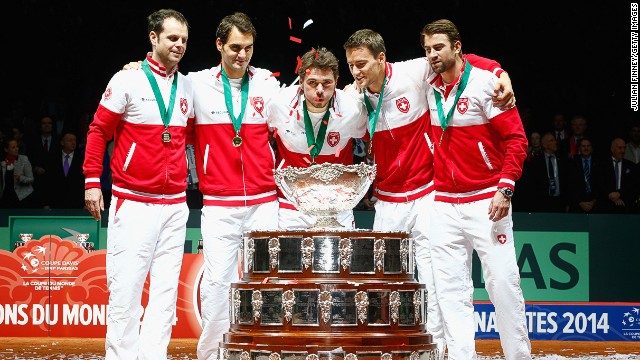 Switzerland got their hands on the Davis Cup for the first time thanks to the efforts of top-10 tennis stars Roger Federer (second left) and Stanislas Wawrinka (center).