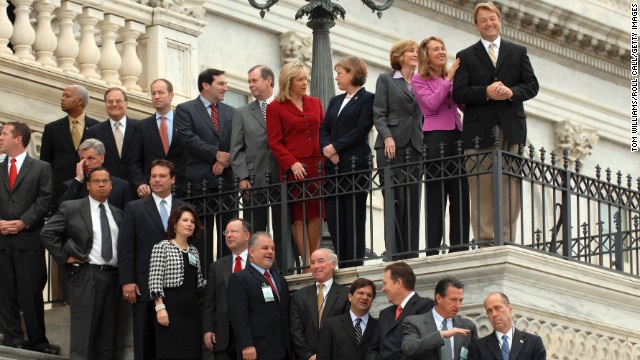 Newly elected representatives, including Giffords at second from top right, prepare for the freshman class picture for the 110th Congress on the House steps on November 14, 2006. She represented Arizona's 8th District from 2007 until her resignation in 2012.