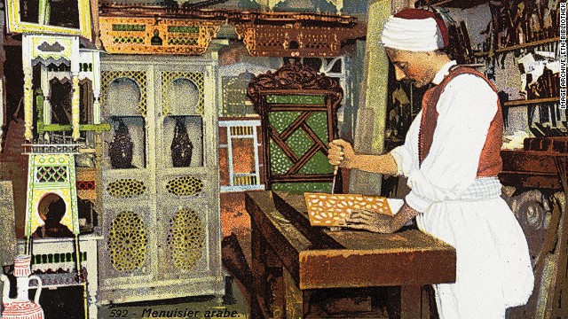 This over-painted 1926 card shows an "Arab carpenter" at work. It's not clear which country the card depicts.