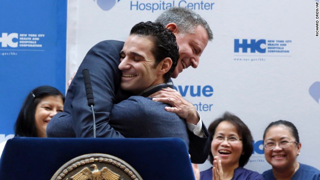 The first Ebola patient in New York City, Dr. Craig Spencer, gets a hug from New York Mayor Bill de Blasio during a news conference at Bellevue Hospital Center on Tuesday, November 11. Now free of Ebola, Spencer was released 19 days after being diagnosed with the virus. The physician had been working with Doctors Without Borders, treating patients in Guinea. 