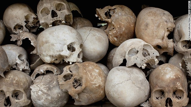 Some of the 8,000 human skulls at the Choeung Ek Genocidal Center in Cambodia sit in a glass case. 