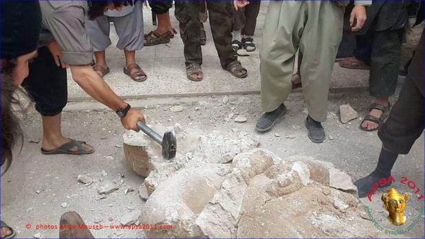 Destruction of Assyrian artifacts by IS militants.