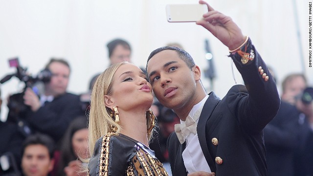 Rousteing's <a href='http://ift.tt/1jj3KoL' target='_blank'>Instagram </a>account has over 600,000 followers and is peppered with photos of Rousteing and his famous friends, like model Rose Huntington-Whiteley who he poses with for a selfie at this year's Met Gala in New York. 