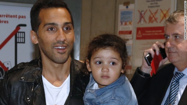 The 34-year-old, here holding one of his two young daughters, had not been able to leave Qatar after he filed a complaint against his club Al-Jaish over a payment dispute. 