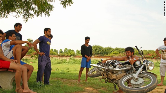 To train, the men lift motorcycles weighing 300 kilograms (about 660 lbs).