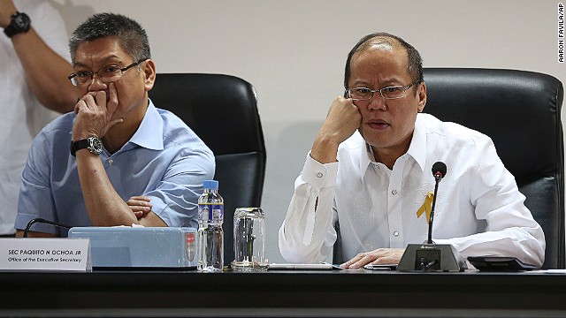 Philippine President Benigno Aquino III, right, and Executive Secretary Paquito Ochoa watch the presentation of officials of the National Disaster Risk Reduction & Management Council in Manila. 