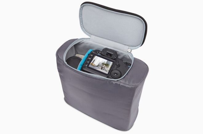 The padded camera pod slots into the bottom of the Convert bag, where it can be quickly removed or accessed via a side panel.