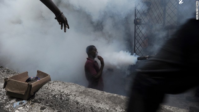 Workers from Haiti's Ministry of Public Health and Population spray chemicals to exterminate mosquitoes. Mosquito control is the main strategy used to prevent further spread of disease.