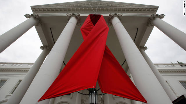 A red ribbon is hung between columns on the north side of the White House to commemorate World AIDS Day November 30, 2010 in Washington, DC. 