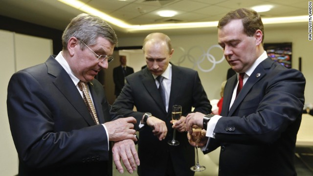 <strong>February 23:</strong> From left, International Olympic Committee President Thomas Bach, Russian President Vladimir Putin and Russian Prime Minister Dmitry Medvedev look at their watches before the <a href='http://ift.tt/1hesTAK'>closing ceremony of the Winter Olympics</a> in Sochi, Russia.