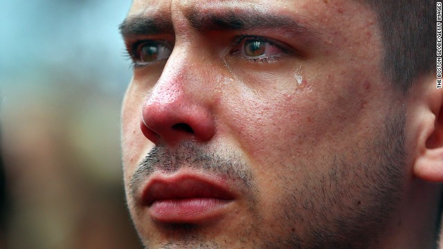 <strong>April 15:</strong> Boston University student Sebastian Filgueira-Gomez has tears in his eyes during a moment of silence for the<a href='http://ift.tt/1iYI5QA'> one-year anniversary of the Boston Marathon bombings</a>. He was standing on Boston's Boylston Street, a block from the marathon's finish line.
