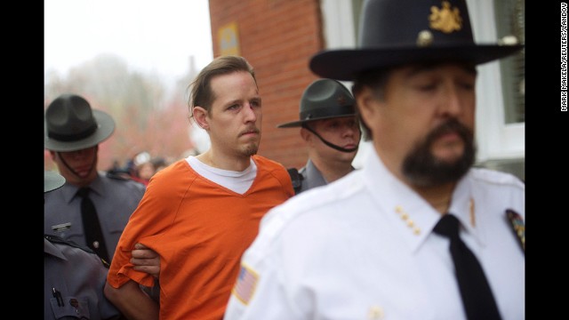<strong>October 31:</strong> <a href='http://ift.tt/1sludp9' target='_blank'>Eric Matthew Frein</a> exits the Pike County Courthouse after his arraignment in Milford, Pennsylvania. Frein, who is accused of killing a Pennsylvania state trooper and wounding another, was found at an abandoned airport near Tannersville, Pennsylvania, authorities said. He had been on the run for nearly two months.