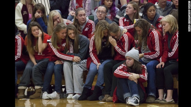 <strong>October 26: </strong>Students grieve during a gathering at Marysville-Pilchuck High School in Marysville, Washington. Law enforcement officials say Jaylen Fryberg, a popular freshman at the school, <a href='http://ift.tt/1yvbYBD'>shot five fellow students</a> before committing suicide on October 24.