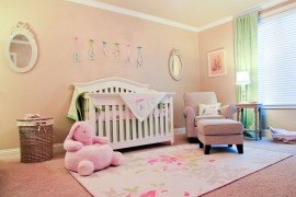 Soft peachy pink and green shape the nursery inspired by English countryside