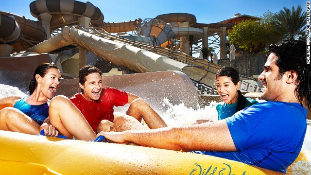 Surfing machines, water slides and an artificial waterfall refresh crowds in the desert heat at Wild Wadi Water Park in Dubai, named sixth-best water park.