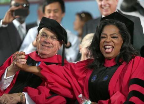 Thomas Menino sat with Oprah Winfrey at Harvard’s graduation ceremony, where both recevied honorary doctorates. 