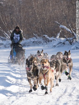 <strong>Dog mushing (Canada)</strong>: When your team of faithful friends aren't whizzing you across Yukon's ice plains, you'll sleep in a tent with a wood stove, in a throwback to the days before commercialized mushing tours "softened down for the arm-chair traveler," says the company.