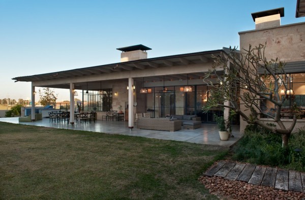 This large stone house has a feel that's a bit reminiscent of a (very stylish) home in the American Southwest.