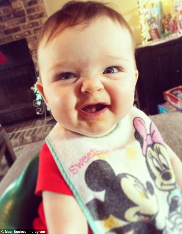 'This little lady!': Last month Maci posted this cute image of their little girl in a Mickey and Minnie bib smiling