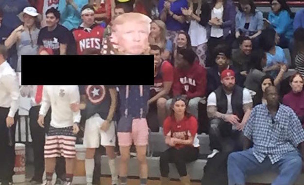 Students at a private Catholic high school in Indiana are under fire after allegedly shouting racist rhetoric while holding a Trump fathead at a basketball game.