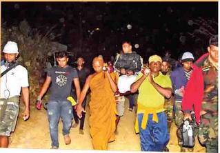  Disabled war heroes assisted by Buddhist Monks to Adams Peak