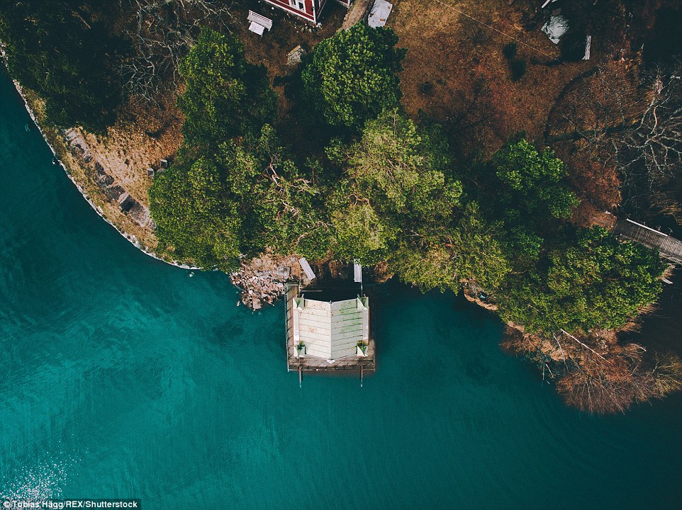 This aerial photo of Sweden shows a boat house located on a island in Malarbaden, Sweden