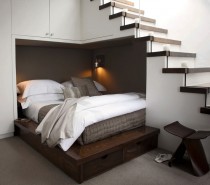 One example of simple space repurposing would be to utilize the unused area under a staircase, like this cozy double bed set up. The custom made platform bed fits snugly into the under-stair alcove, and the design also incorporates under-bed and over-bed storage that runs straight into the side of the stairs too.