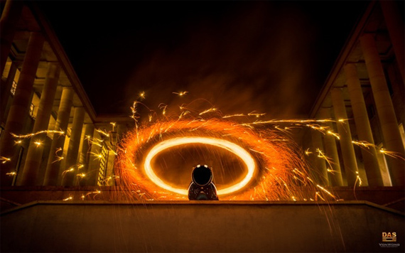 sculpture with fiery background