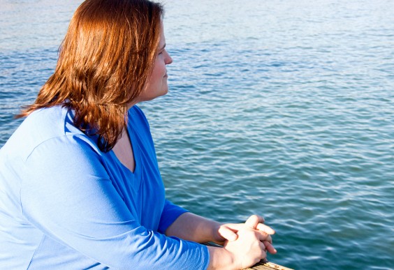 On Concern for Your Fat Friend's Health: Woman looking out over the sea