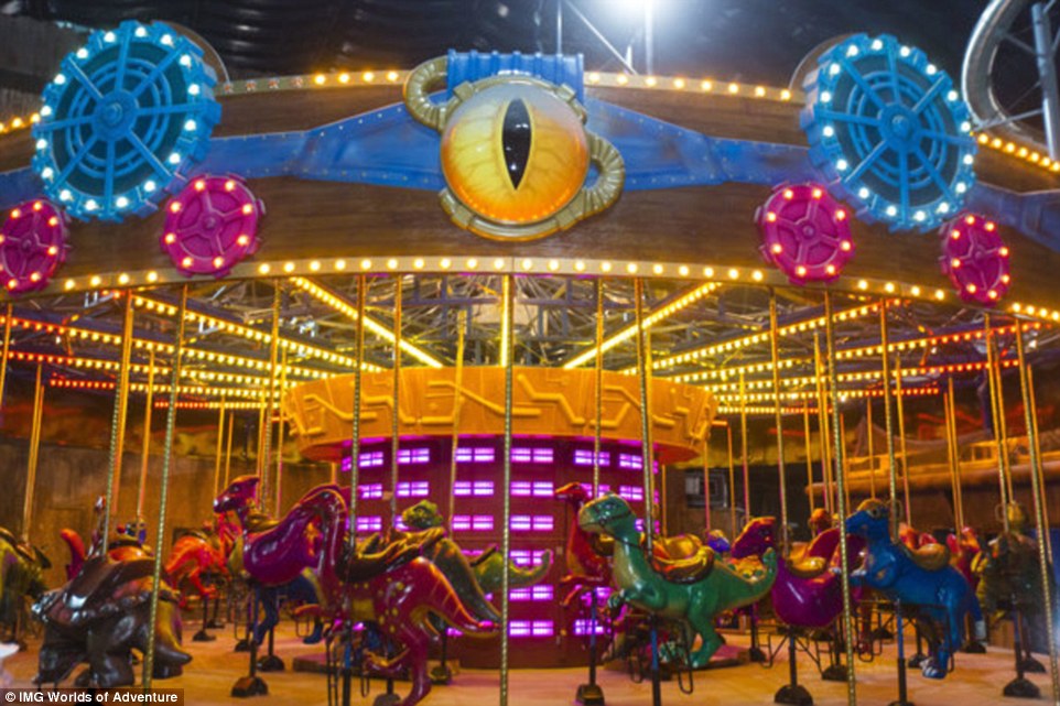 The new 1.5 million-square-foot indoor amusement park, located on the city's desert outskirts, will open on August 15. Pictured is the park's carousel, which features dinosaurs instead of horses to ride upon