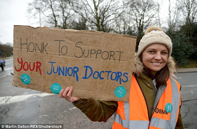 Judicial review: The BMA has announced it is launching a judicial review in which a judge will assess if the Government followed due process when imposing the contract. Pictured, a junior doctor on strike outside Whipps Cross hospital in Waltham Forest, London