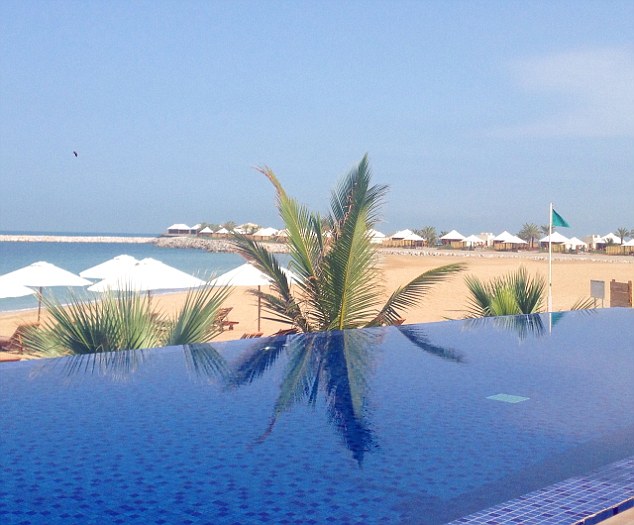 Guests can enjoy breakfast overlooking the infinity pool and the Arabian Gulf during a stay at the beach resort