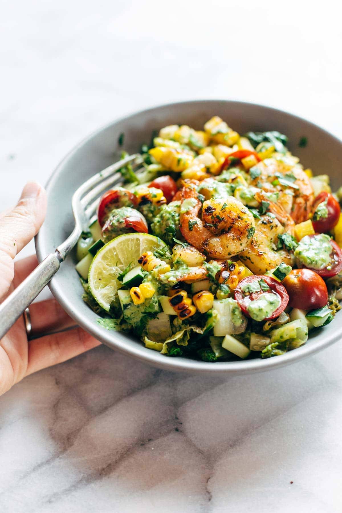 Glowing Grilled Summer Detox Salad! with grilled romaine, lime, tomato, cucumber, avocado, corn, shrimp, and cilantro dressing. | pinchofyum.com
