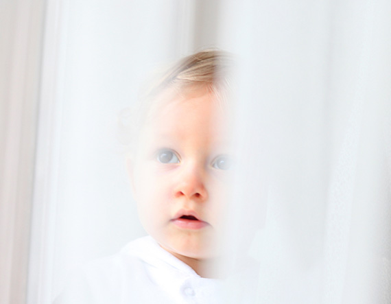 baby in window stock photography