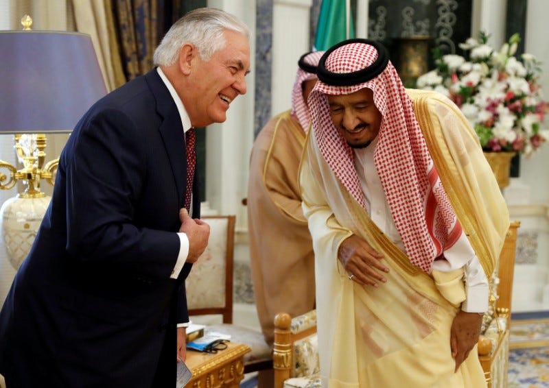 U.S. Secretary of State Rex Tillerson and Saudi King Salman speak before their meeting in Riyadh, Saudi Arabia, October 22, 2017. REUTERS/Alex Brandon/Pool