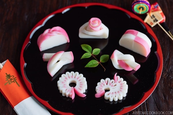 7 kinds of Decorative Kamaboko (Fish Cake) on a Japanese lacquer plate.
