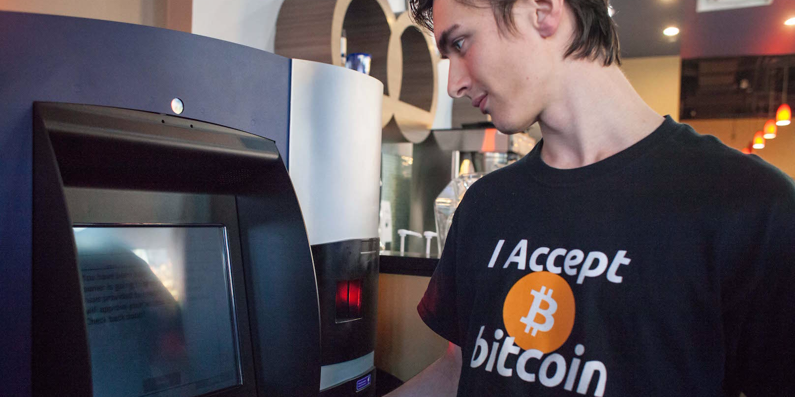 Gabriel Scheare uses the world's first bitcoin ATM on October 29, 2013 at Waves Coffee House in Vancouver, British Columbia. Scheare said he 'just felt like being part of history.' The ATM, named Robocoin, allows users to buy or sell the digital currency known as bitcoins. Once only used for black market sales on the internet, bitcoins are starting to be accepted at a growing number of businesses. (Photo by )