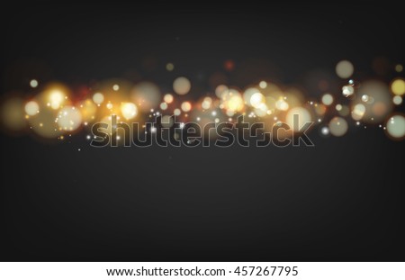 Soft bokeh and lights. Shiny sunburst of circle bokeh with the abstract black background. Abstract background. Gold template over black background with golden sparks.