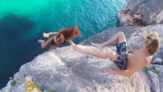 Selfish boyfriend pulls leg away as his girlfriend falls off a cliff 