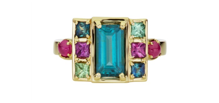 The Jane Taylor jewelry Cirque Petite Cloud Swing ring in 18K yellow gold with 1.57ctw indicolite tourmaline baguette, 1.13ctw green & purple sapphire, and .35ctw ruby cabochons.